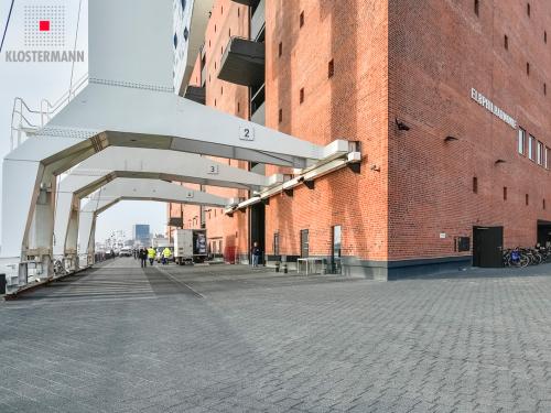 Brick building and harbour cranes